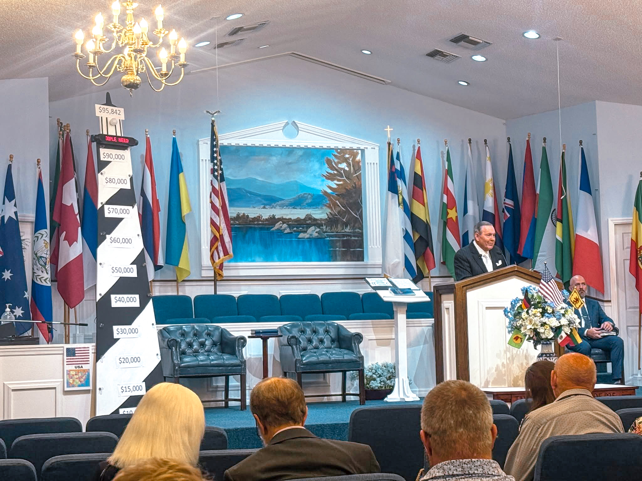 Liberty Baptist Church Missions Conference with international flags in the sanctuary
